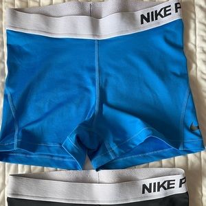 2 pairs Nike pro shorts